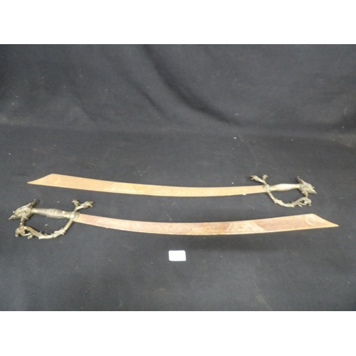 625 - Pair of wooden replica of Spanish swords, length 90cms