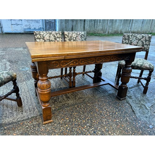 50A - An oak drawer leaf table with a set of six oak framed chairs 127x 77x 77