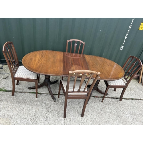 140H - A mahogany d-end dining table with four chairs