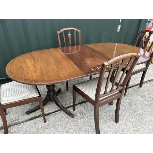 140H - A mahogany d-end dining table with four chairs