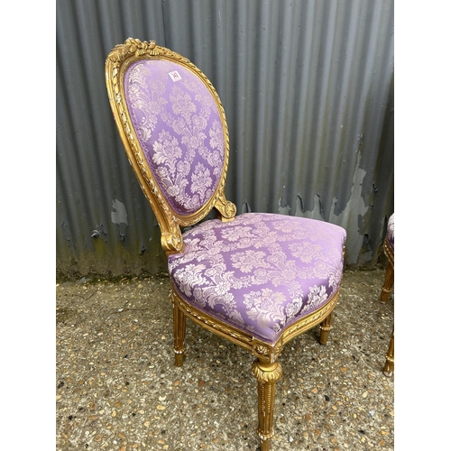 140M - A pair of gold gilt chairs with pink upholstery