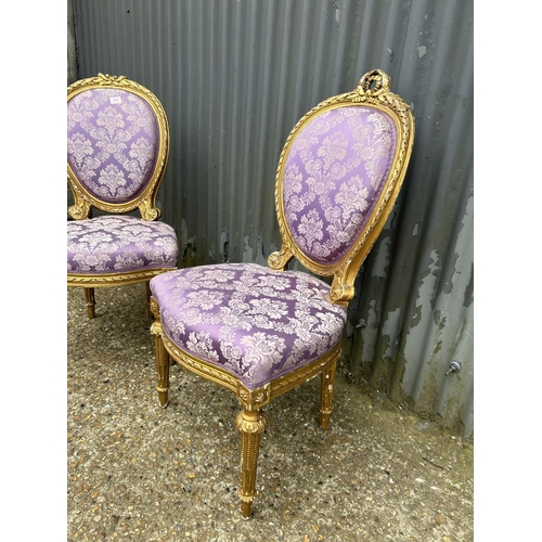 140M - A pair of gold gilt chairs with pink upholstery