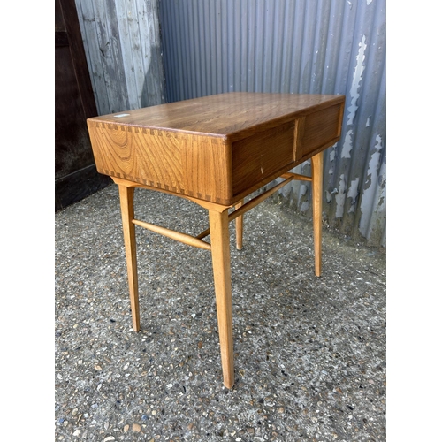 1 - An ercol light elm single drawer writing desk 49x64 x74