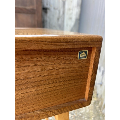 1 - An ercol light elm single drawer writing desk 49x64 x74