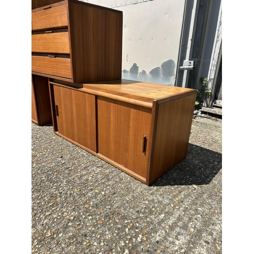 12 - A collection of mid century danish teak (unmarked) wall mounting units, consisting of three four dra... 