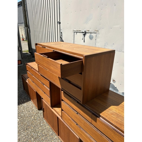 12 - A collection of mid century danish teak (unmarked) wall mounting units, consisting of three four dra... 