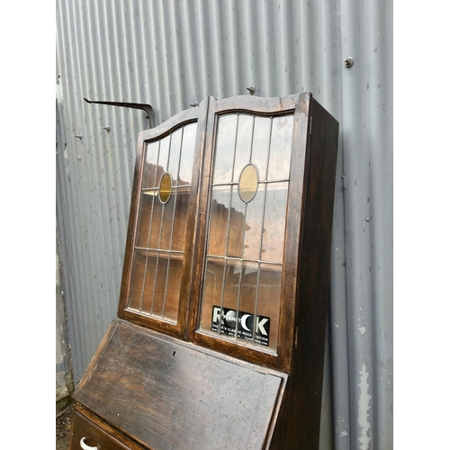 122 - A leaded oak bureau bookcase