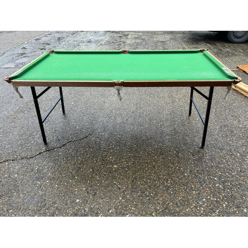 128 - A folding snooker table with balls and score board 190x98