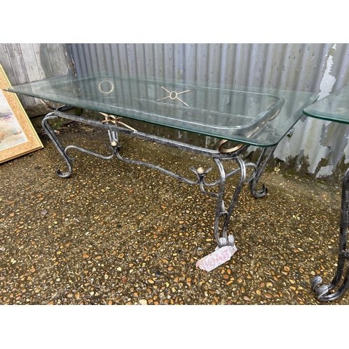 130 - A metal based coffee table together with matching side table, both with glass tops