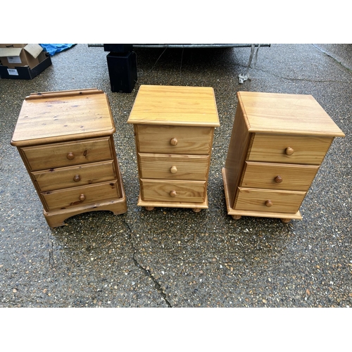 135 - A pair of pine bedsides together with an additional pine bedside