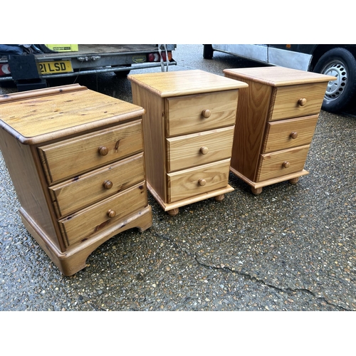 135 - A pair of pine bedsides together with an additional pine bedside