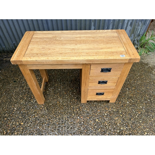 143 - A light oak kneehole desk 107x 50x79