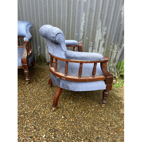 147 - A pair of Edwardian blue upholstered tub shaped salon chairs