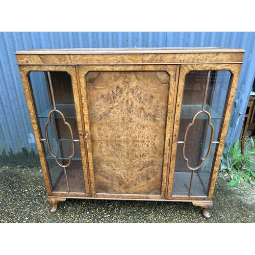 148 - A glazed walnut display cabinet 118cm wide