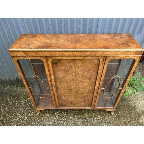 148 - A glazed walnut display cabinet 118cm wide