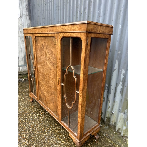 148 - A glazed walnut display cabinet 118cm wide