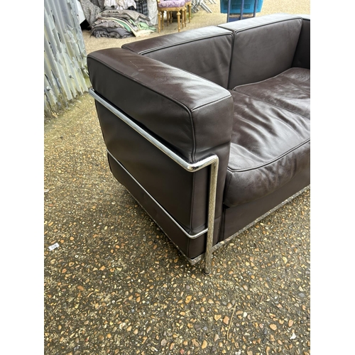 188 - A chrome framed designer sofa in the style of Le corbussier LC2 125x66x86