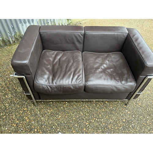 188 - A chrome framed designer sofa in the style of Le corbussier LC2 125x66x86