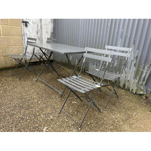 190 - A modern folding garden table and four folding chairs from 'Alice's garden' 110x70