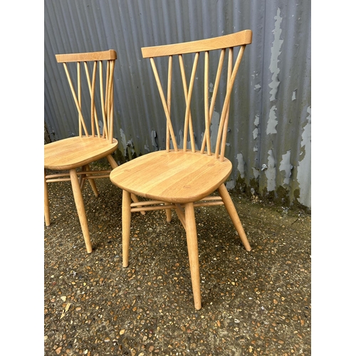 193 - A pair of modern ercol stick back chairs