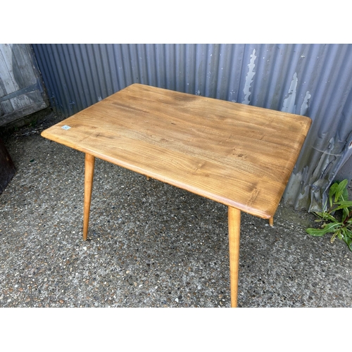 2 - An ercol light elm kitchen table 100x70x72