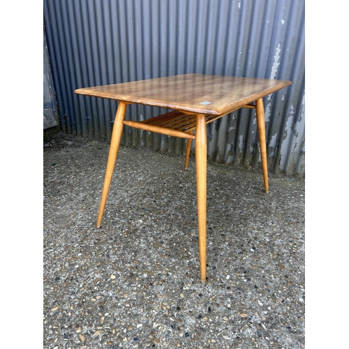 2 - An ercol light elm kitchen table 100x70x72