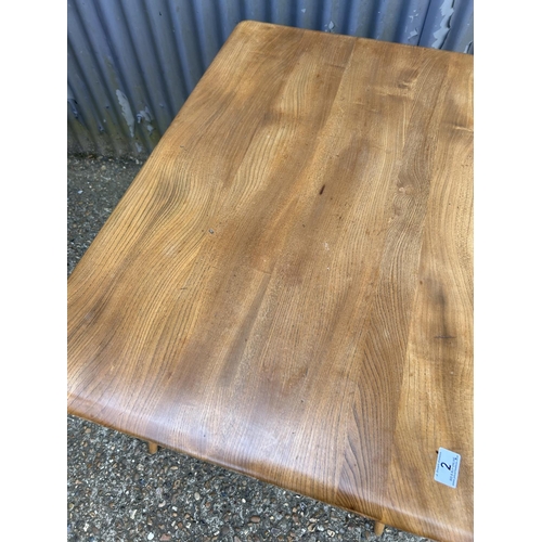 2 - An ercol light elm kitchen table 100x70x72