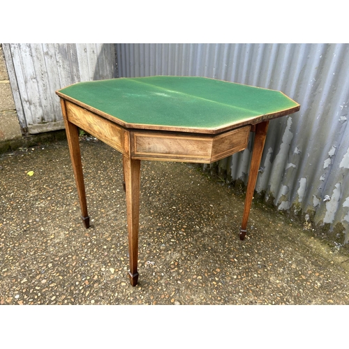 211 - A Victorian inlaid fold over card table with green baize top