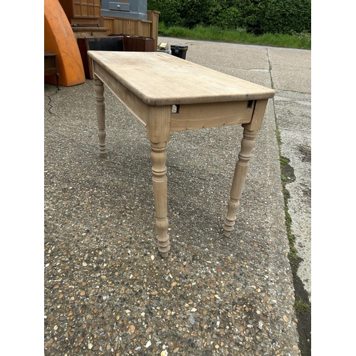 215 - A stripped pine table 120x54 x 74