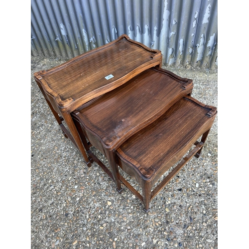 22 - A rosewood nest of three tables