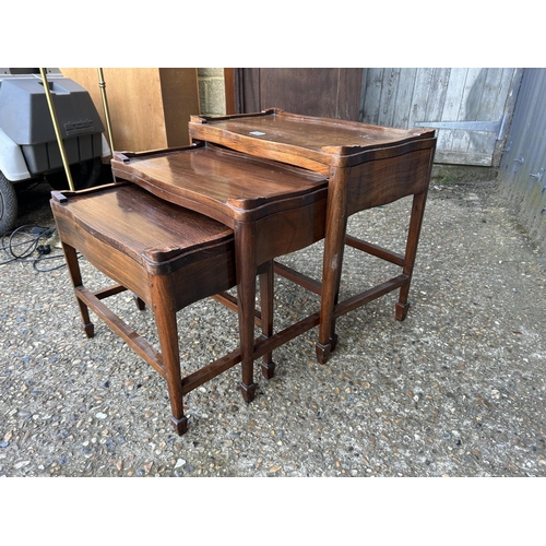 22 - A rosewood nest of three tables