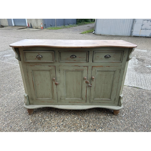 221 - A French pine three drawer sideboard, painted green 154x54x110