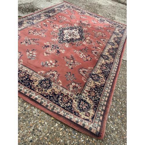 228 - A large red / blue pattern carpet 200x298