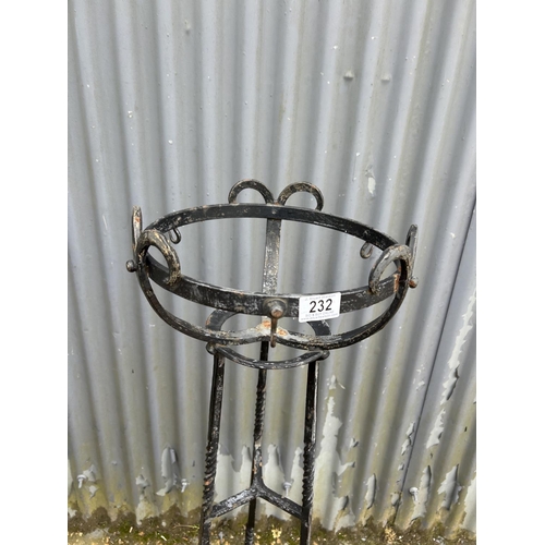 232 - An ornate iron plant stand 120cm tall