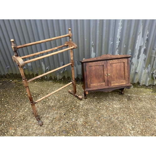 237 - An oak wall cabinet together with a Edwardian towel rail