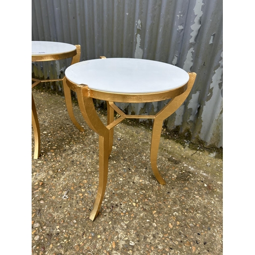 239 - A pair of gilt painted side tables with white glass tops