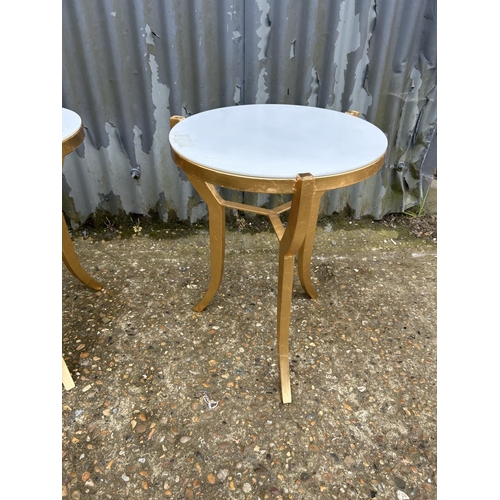 239 - A pair of gilt painted side tables with white glass tops