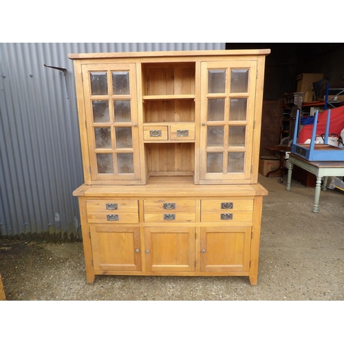 254 - A large light oak dresser with glazed top over six drawer and cupboard door base 160x60x204