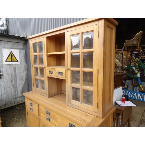 254 - A large light oak dresser with glazed top over six drawer and cupboard door base 160x60x204