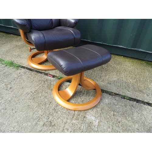 271 - A reclining brown leather easy chair with stool