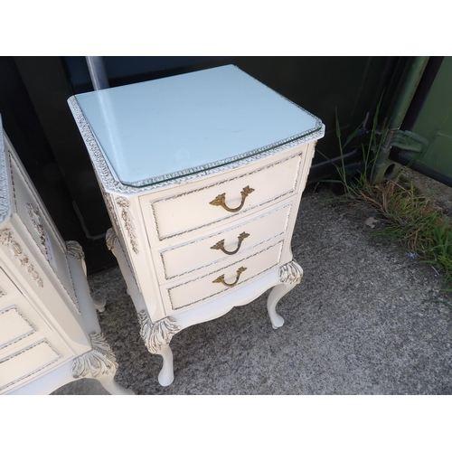 279 - A pair of French style white and gilt three drawer bedsides