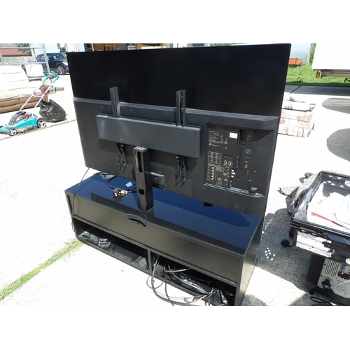 291 - A Panasonic 55 inch OLED tv on cabinet stand with remote