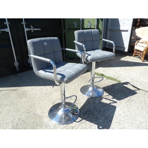 295 - A pair of chrome and grey gas lift bar stools