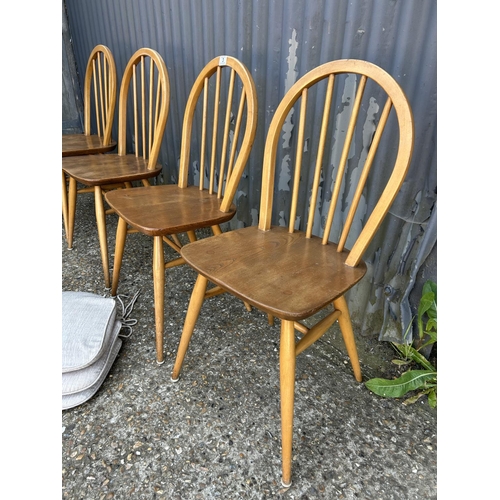 3 - A set of four ercol stick back chairs (with three seat pads )