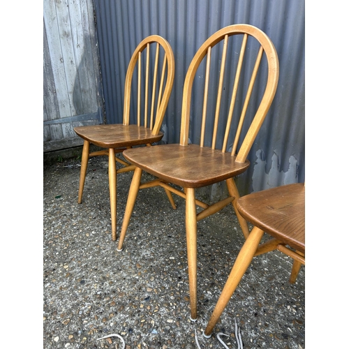 3 - A set of four ercol stick back chairs (with three seat pads )