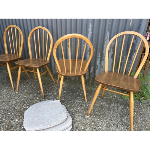 3 - A set of four ercol stick back chairs (with three seat pads )