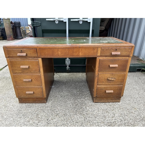 314 - A early 20th century oak twin pedestal desk 135cm wide