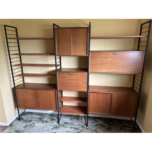 342 - A Mid century LADDERAX 3 bay home wall system, with three sliding door cupboards, bureau, drinks com... 