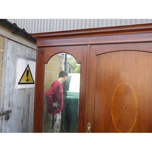 343 - A large Edwardian mahogany triple wardrobe with inlay and fitted interior