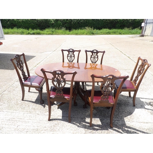 349 - A reproduction mahogany dining table together with mahogany chairs with drop in leather upholstered ... 